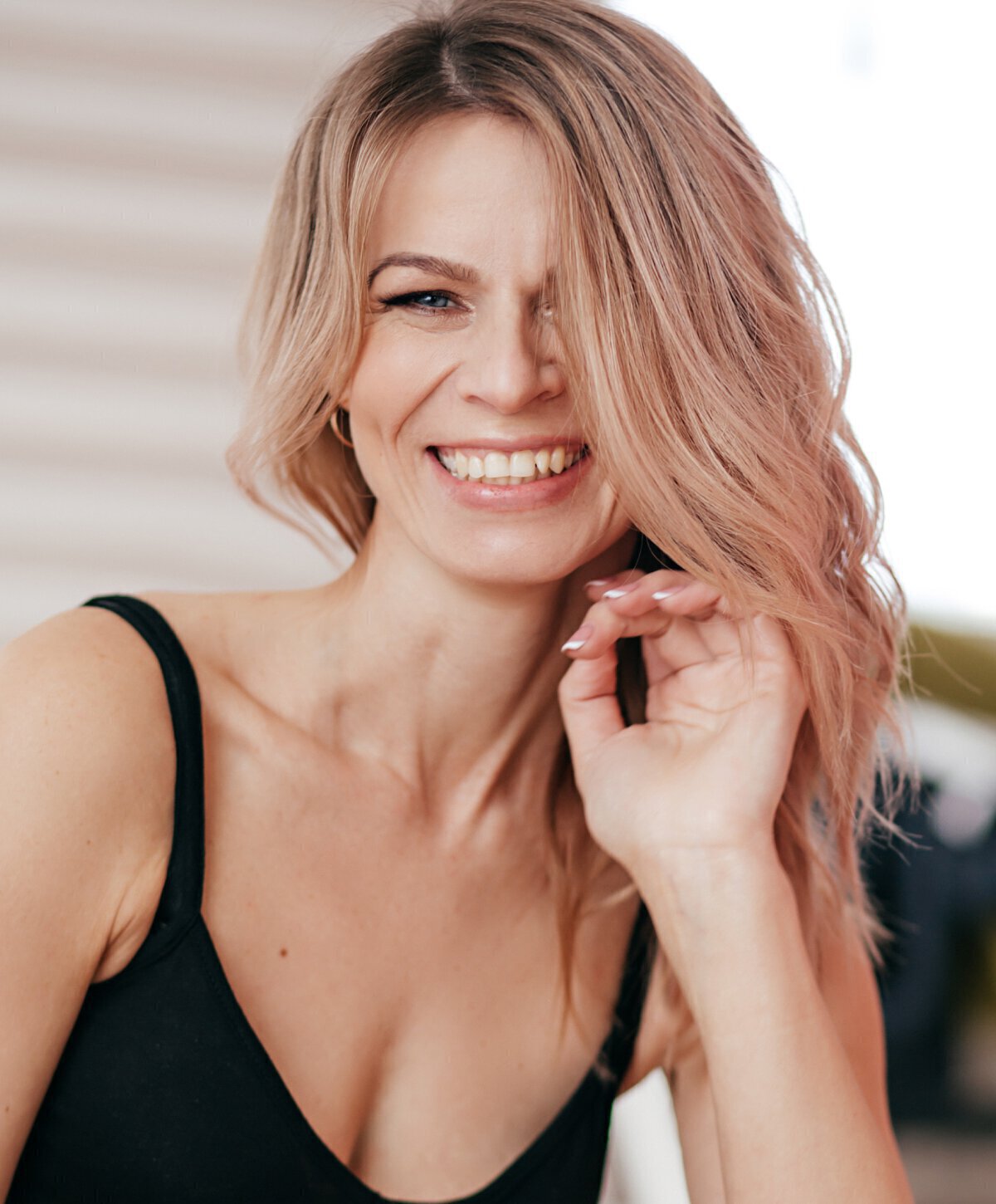 blonde woman with black top