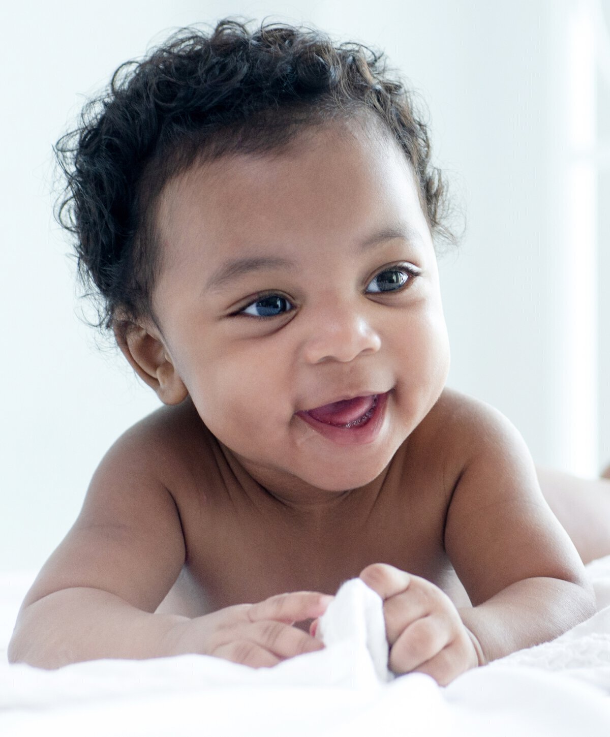 dallas craniofacial surgery baby model laying on bed