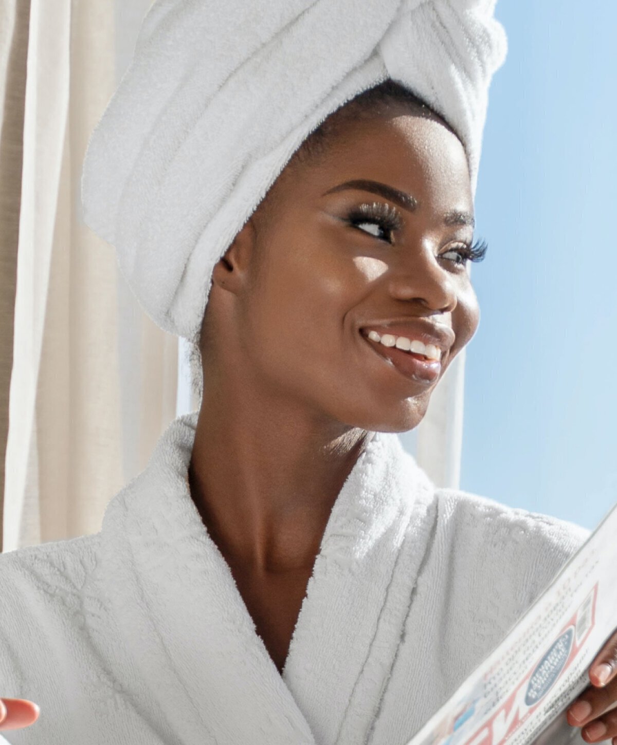 dallas radiesse model in white bathrobe smiling