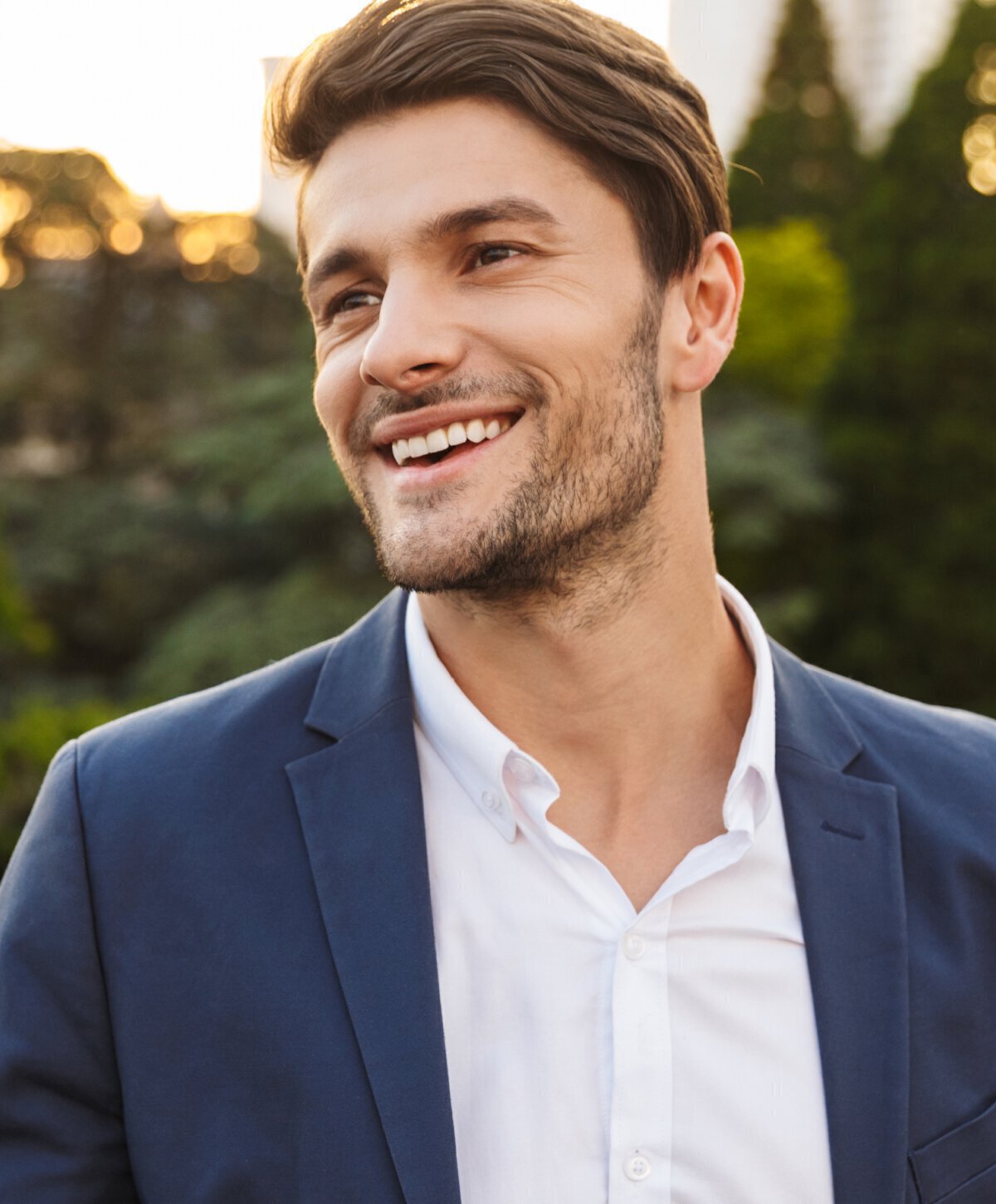 dallas male chin augmentation model in blue suit smiling