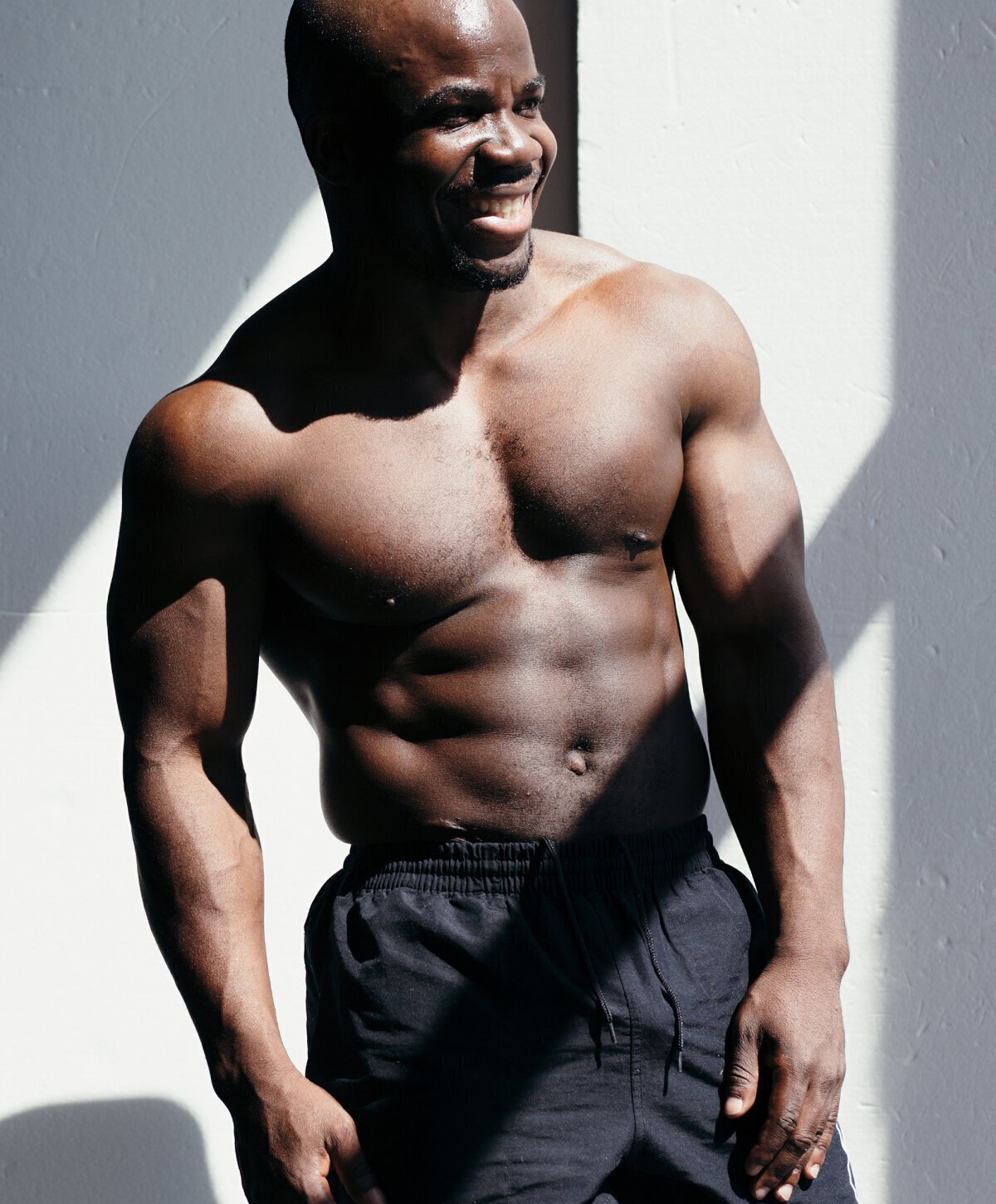 dallas gynecomastia surgery model wearing black shorts