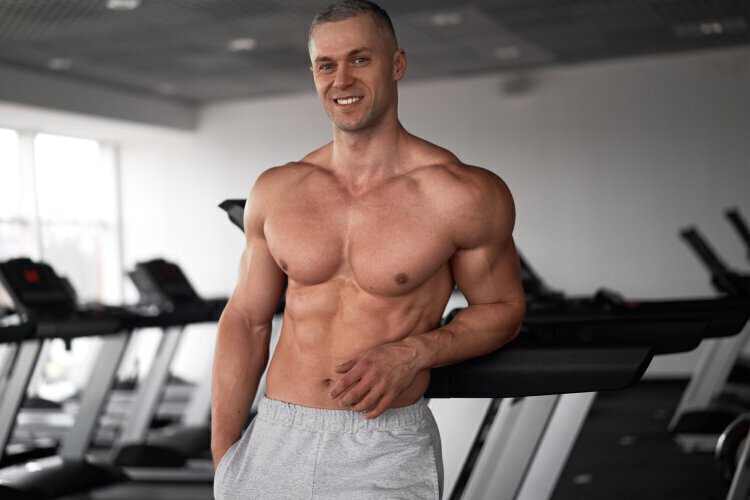 male plastic surgery model in the gym