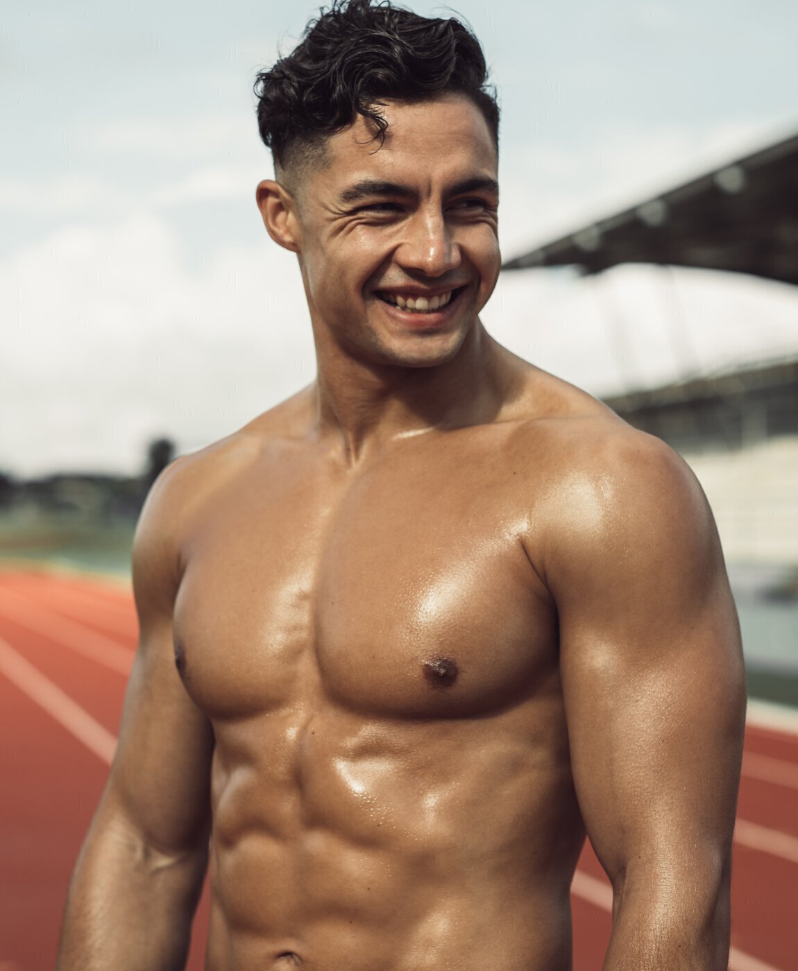 Muscular man on a running track